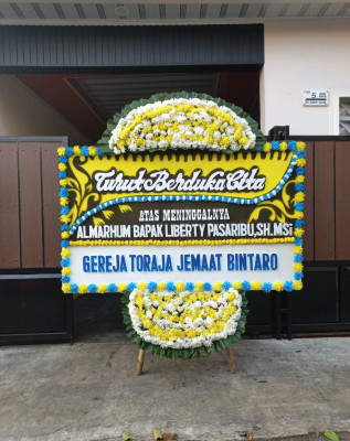 Papan Bunga Duka di Kayu Bongkok